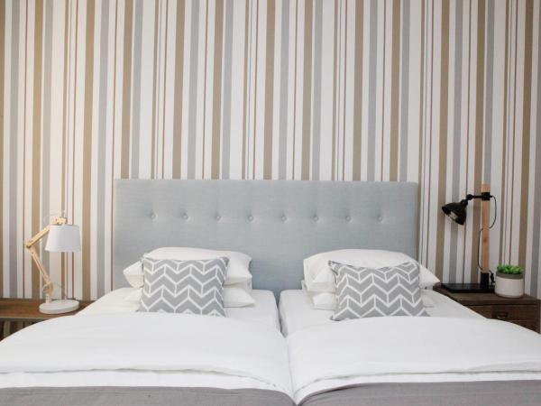 Flores Guest House : photo 2 de la chambre chambre double ou lits jumeaux supérieure