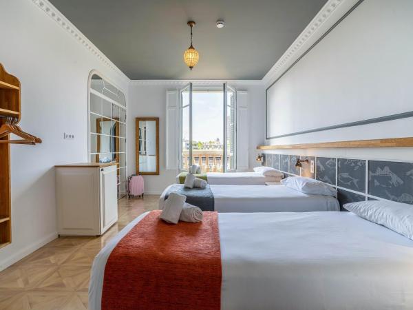 Casa Gracia : photo 1 de la chambre  chambre triple - vue sur ville