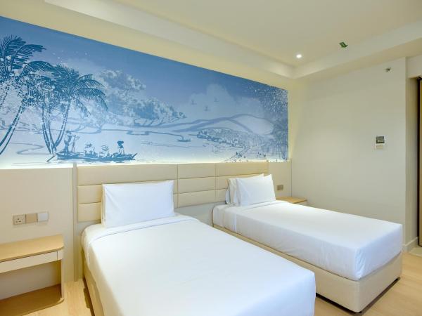 Cititel Express Kota Kinabalu : photo 2 de la chambre chambre lits jumeaux supérieure