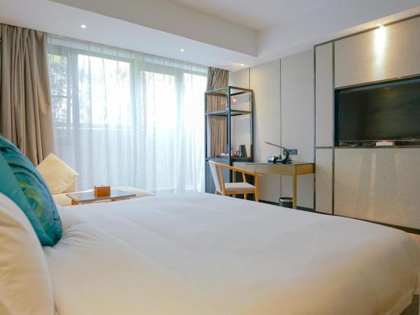 Paco Hotel Tiyuxilu Metro Guangzhou-Free Shuttle Bus for Canton Fair : photo 1 de la chambre chambre lit queen-size 