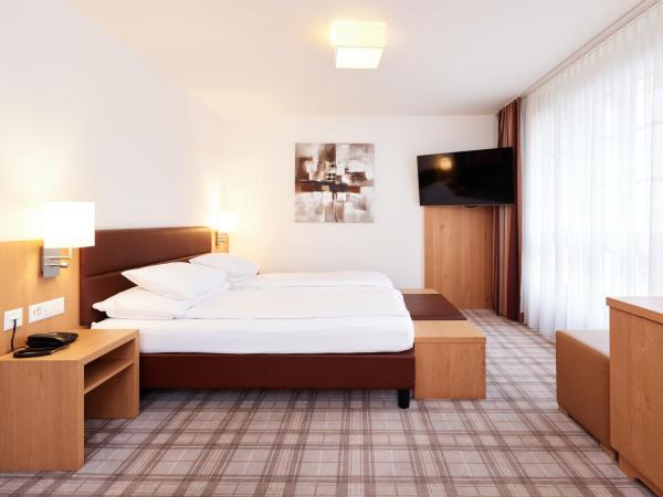 Central City Hotel Rochat : photo 3 de la chambre chambre triple