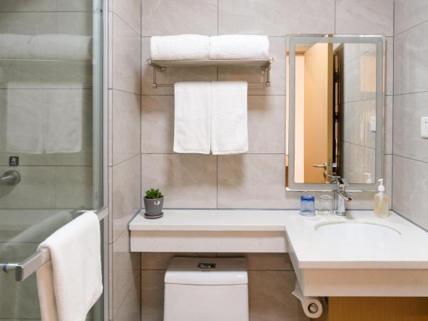 Shanghai JOYFUL YARD Hotel-Free shuttle bus from Pudong Airport and Disneylan : photo 1 de la chambre chambre lits jumeaux deluxe