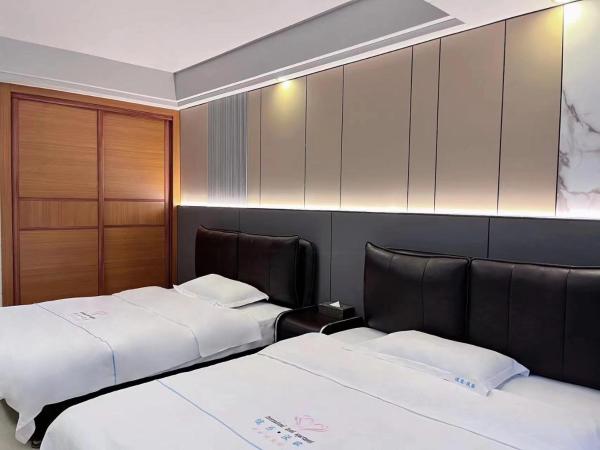 广州沃家国际公寓 : photo 3 de la chambre chambre deluxe double ou lits jumeaux
