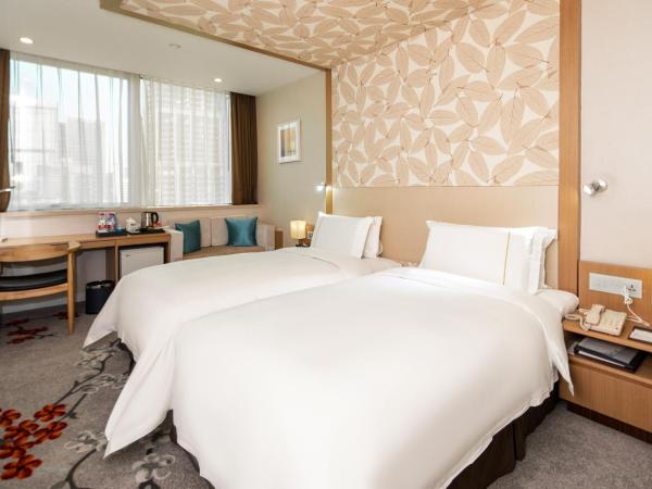 China Mayors Plaza - Free shuttle between hotel and Exhibition Center during Canton Fair : photo 3 de la chambre chambre lits jumeaux confort