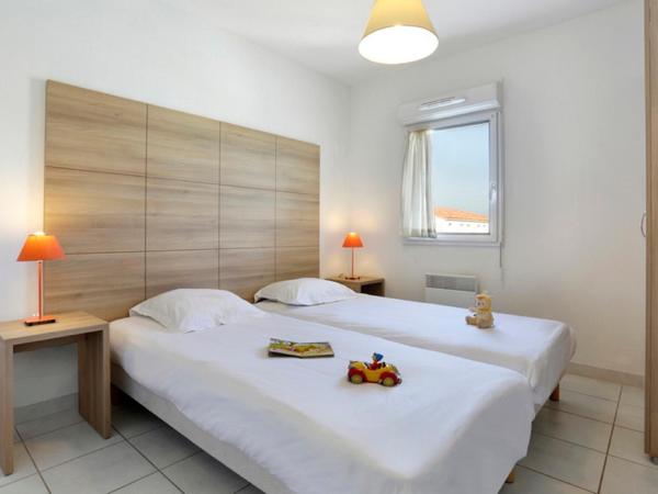 Vacancéole - Résidence Cap Camargue : photo 1 de la chambre appartement en duplex 2 chambres avec climatisation - vue sur piscine