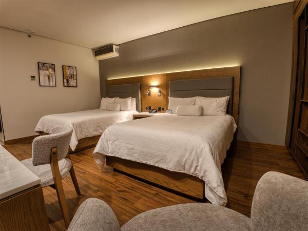 Victoria Ejecutivo : photo 7 de la chambre chambre double supérieure avec deux lits doubles