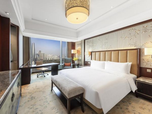 Shangri-La Shenyang : photo 1 de la chambre chambre lit king-size deluxe - vue sur jardin