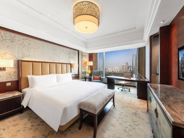 Shangri-La Shenyang : photo 5 de la chambre chambre lit king-size deluxe - vue sur jardin