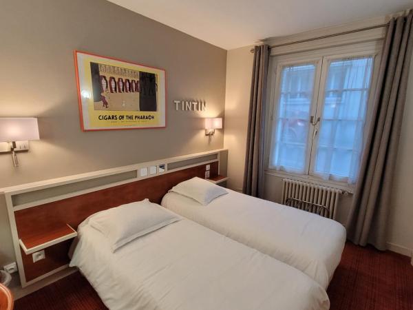 Logis Hôtel Restaurant LE MONARQUE : photo 3 de la chambre chambre lits jumeaux avec salle de bains privative