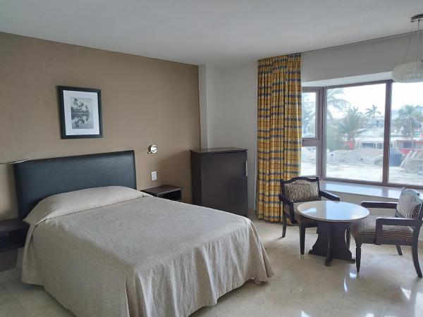 Hotel Mar y Tierra : photo 1 de la chambre chambre quadruple
