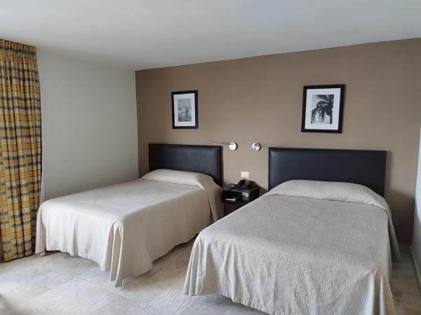 Hotel Mar y Tierra : photo 3 de la chambre chambre quadruple