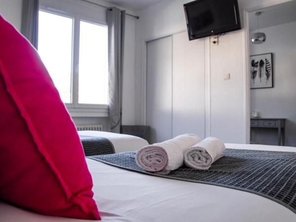 Hôtel Le Tivoli : photo 4 de la chambre chambre lits jumeaux confort