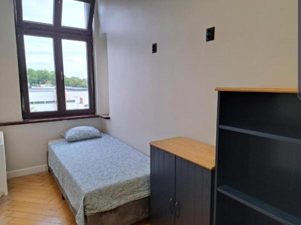 Kopernik Premium Rooms Apartment : photo 1 de la chambre chambre double ou lits jumeaux