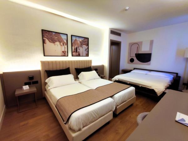 Vittoria Parc Hotel : photo 1 de la chambre chambre quadruple