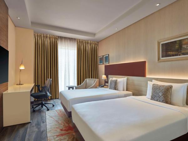 DoubleTree by Hilton Gurugram Baani Square : photo 1 de la chambre chambre lits jumeaux supérieure