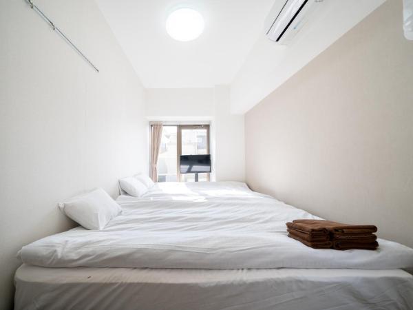 Nishinippori Guest House : photo 6 de la chambre chambre quadruple avec salle de bains privative