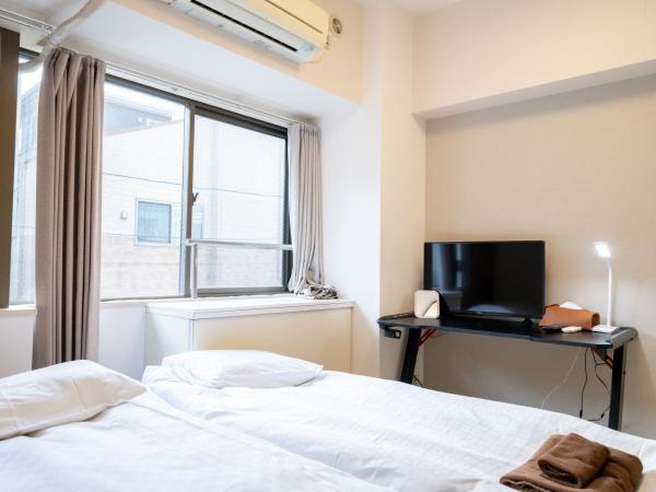 Nishinippori Guest House : photo 3 de la chambre chambre triple avec salle de bains privative