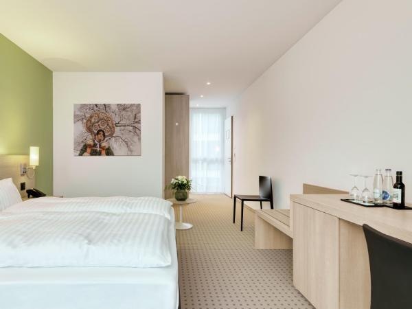 Hotel Eastside (free parking garage) : photo 1 de la chambre chambre double ou lits jumeaux avec parking gratuit