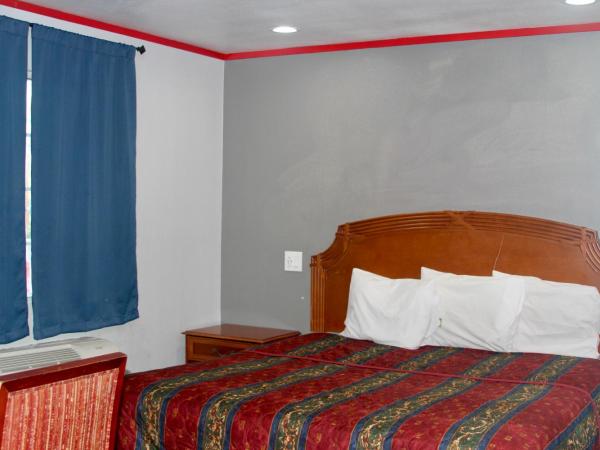 Broadway Inn Motel : photo 1 de la chambre chambre lit king-size deluxe