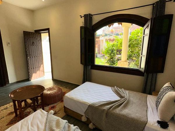 Oasis Merasi Marrakech : photo 5 de la chambre chambre double ou lits jumeaux - vue sur jardin