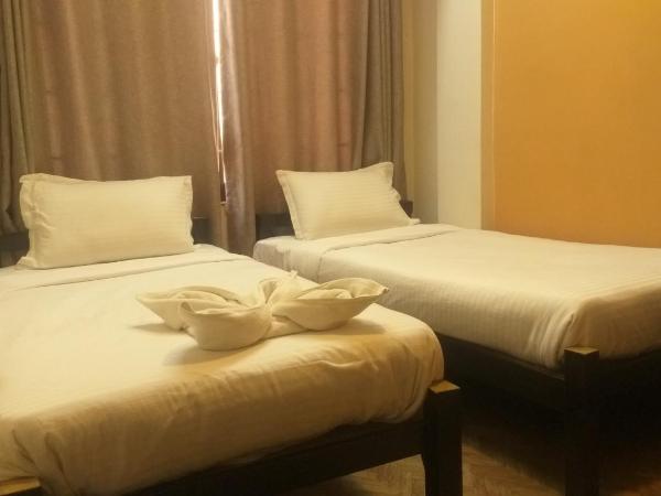 Paradise Guest House : photo 4 de la chambre chambre lits jumeaux avec salle de bains privative