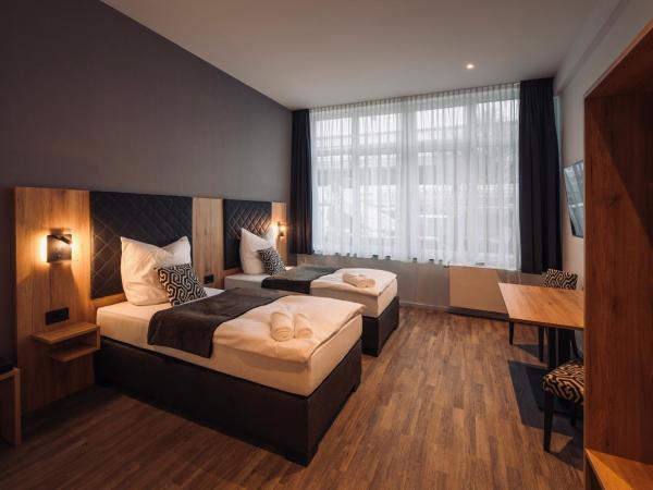 MiDoma, Self Check-In Hotel, Hannover Messe : photo 3 de la chambre chambre lits jumeaux pour personnes à mobilité réduite