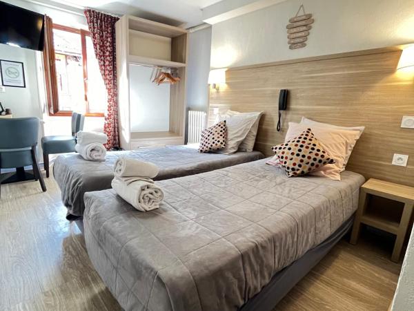 Hôtel Du Cheval Blanc Barcelonnette : photo 2 de la chambre petite chambre lits jumeaux