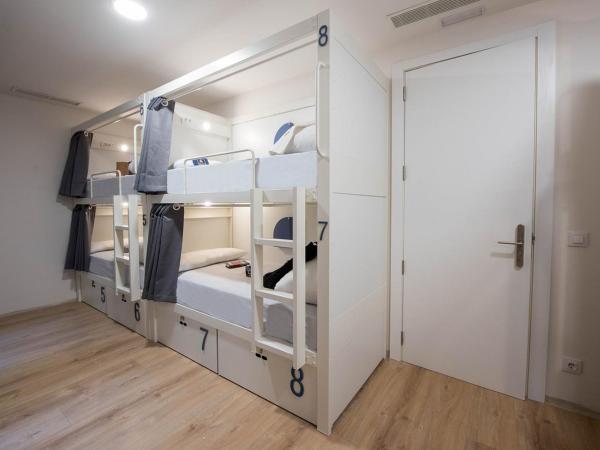 room00 Gran Vía Hostel : photo 1 de la chambre lit simple dans dortoir pour femmes de 8 lits