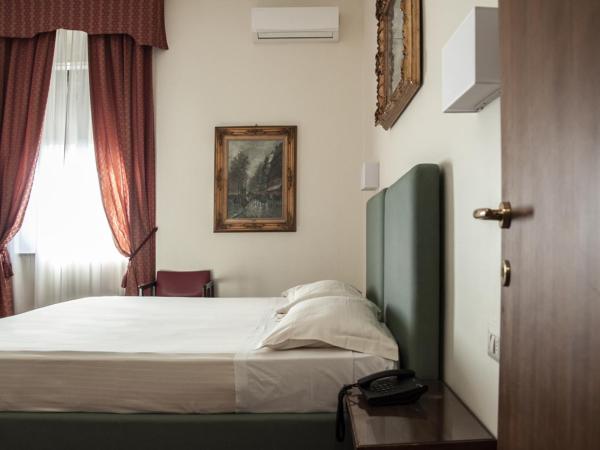 Hotel San Guido : photo 4 de la chambre chambre double ou lits jumeaux avec lit d'appoint