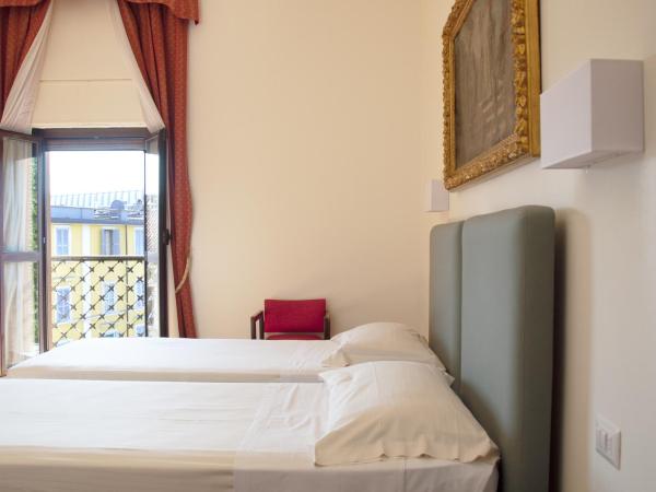 Hotel San Guido : photo 5 de la chambre chambre double ou lits jumeaux avec lit d'appoint