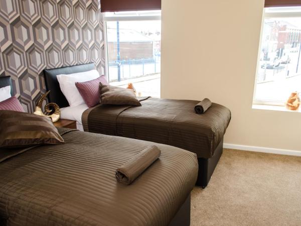 Trivelles Eccles : photo 1 de la chambre chambre lits jumeaux