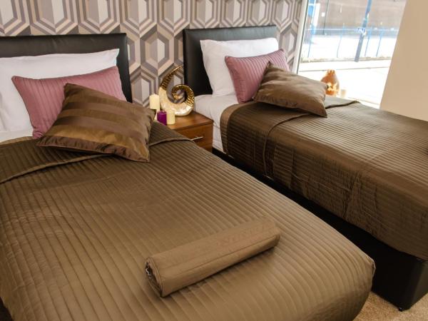 Trivelles Eccles : photo 2 de la chambre chambre lits jumeaux