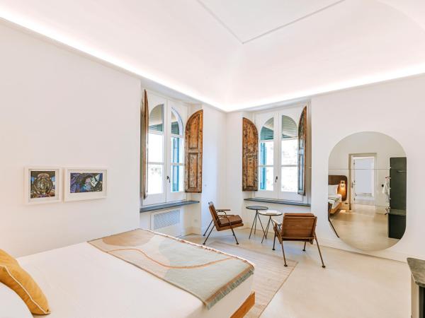 Faro Punta Imperatore : photo 7 de la chambre chambre double deluxe - vue latérale sur mer