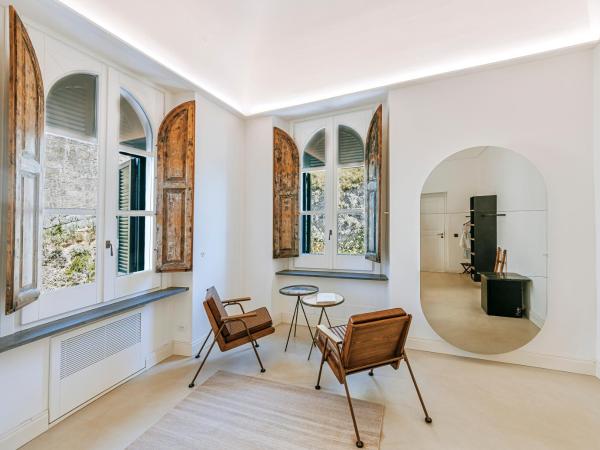 Faro Punta Imperatore : photo 5 de la chambre chambre double deluxe - vue latérale sur mer