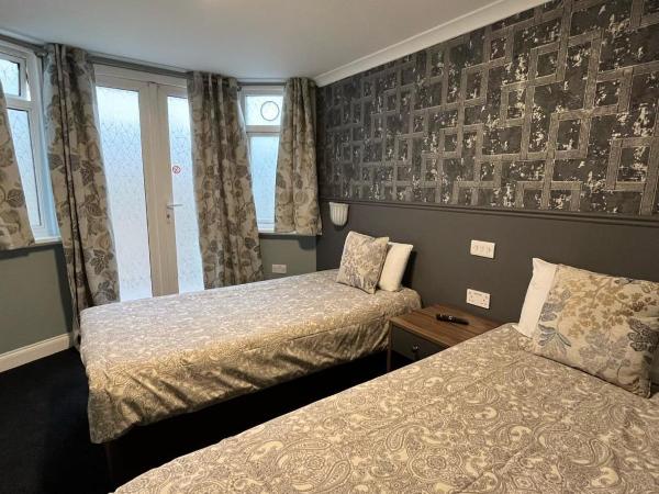 Charlotte Guest House : photo 6 de la chambre chambre quadruple