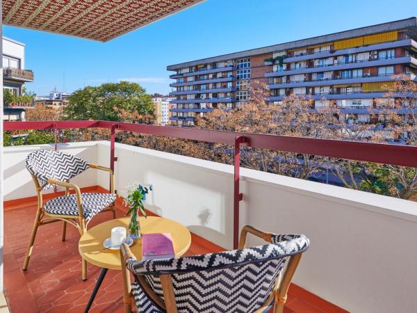 Hesperia Sevilla : photo 5 de la chambre chambre double confort avec terrasse et vue sur la ville