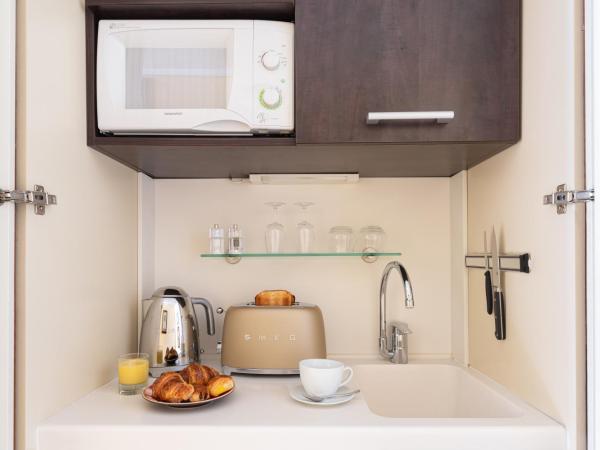 Kipling Manotel : photo 6 de la chambre chambre triple exécutive