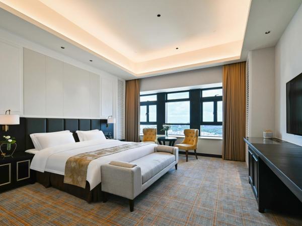 Guangzhou Pan Yu President Hotel : photo 1 de la chambre chambre lit king-size