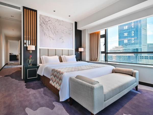 Guangzhou Pan Yu President Hotel : photo 2 de la chambre suite lit queen-size