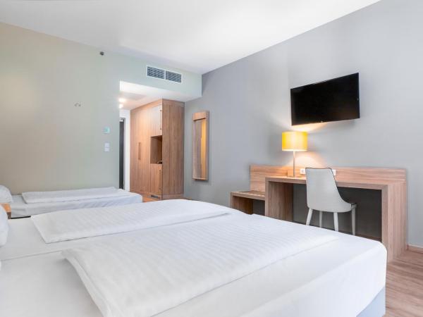 Akeah Verdi Budapest : photo 1 de la chambre chambre triple deluxe