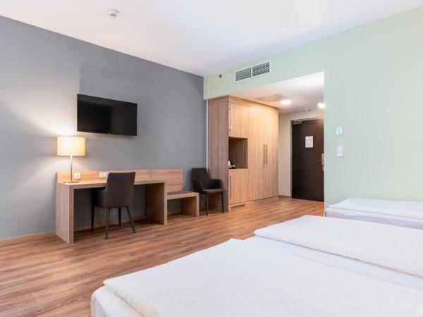 Akeah Verdi Budapest : photo 1 de la chambre chambre familiale