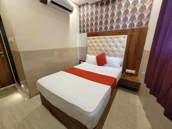 Hotel Dream Palace Residency - Near LBS Marg Kural West : photo 8 de la chambre chambre deluxe