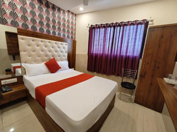 Hotel Dream Palace Residency - Near LBS Marg Kural West : photo 5 de la chambre chambre deluxe