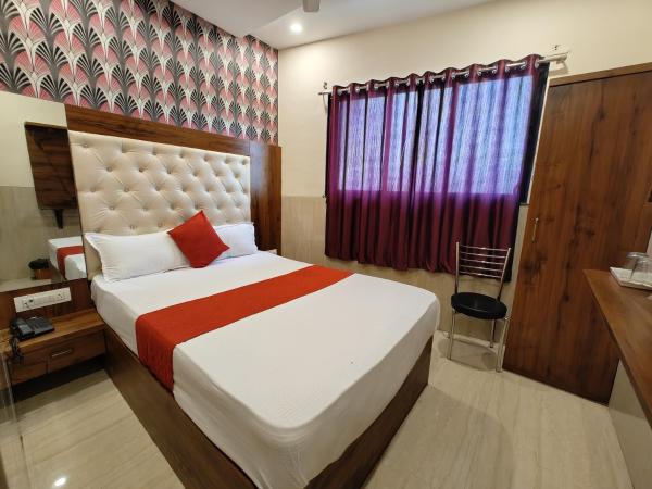 Hotel Dream Palace Residency - Near LBS Marg Kural West : photo 7 de la chambre chambre deluxe