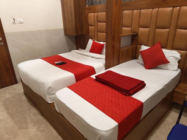 Hotel Dream Palace Residency - Near LBS Marg Kural West : photo 2 de la chambre chambre double ou lits jumeaux