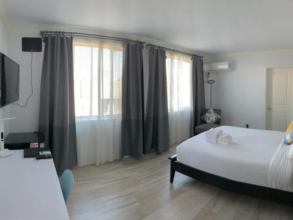 Hometel Suites : photo 7 de la chambre chambre standard lit queen-size