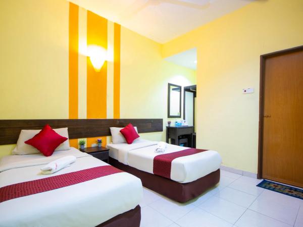 Sun Inns Rest House Kuantan : photo 1 de la chambre hébergement supérieur avec fenêtre