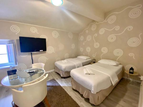 Maison Sarraj Affittacamere : photo 1 de la chambre chambre double ou lits jumeaux avec salle de bains privative