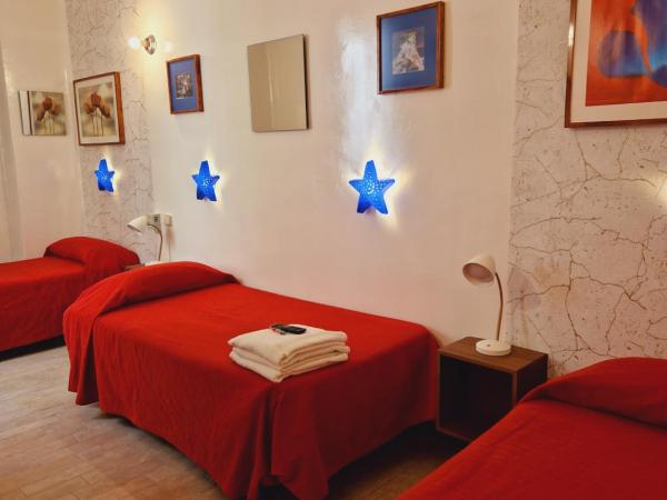 Casa de Huespedes Dolce Vita : photo 3 de la chambre chambre lits jumeaux avec lit d’appoint - 301