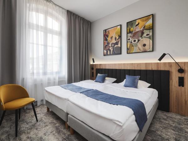 Halo Szczecin : photo 1 de la chambre chambre familiale